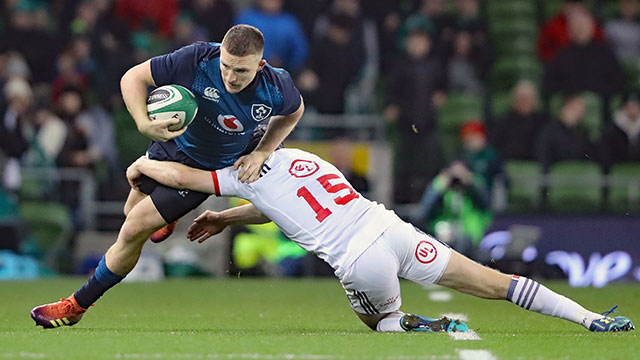 Andrew Conway is tackled by Will Hooley in Ireland v USA match
