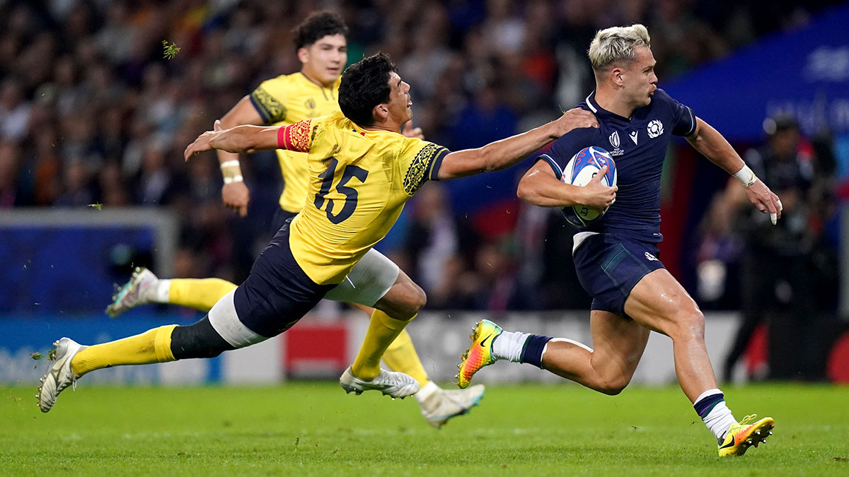 Darcy Graham eludes the Romania defence as he scores a try for Scotland at 2023 Rugby World Cup