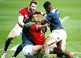 Anthony Watson is tackled during Lions v South Africa A match