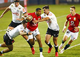 Anthony Watson is tackled during the second Lions v Sharks match