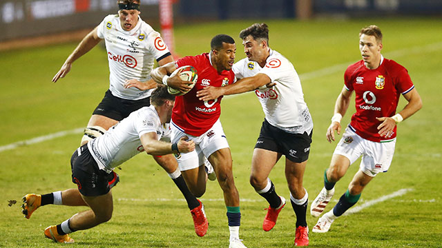 Anthony Watson is tackled during the second Lions v Sharks match