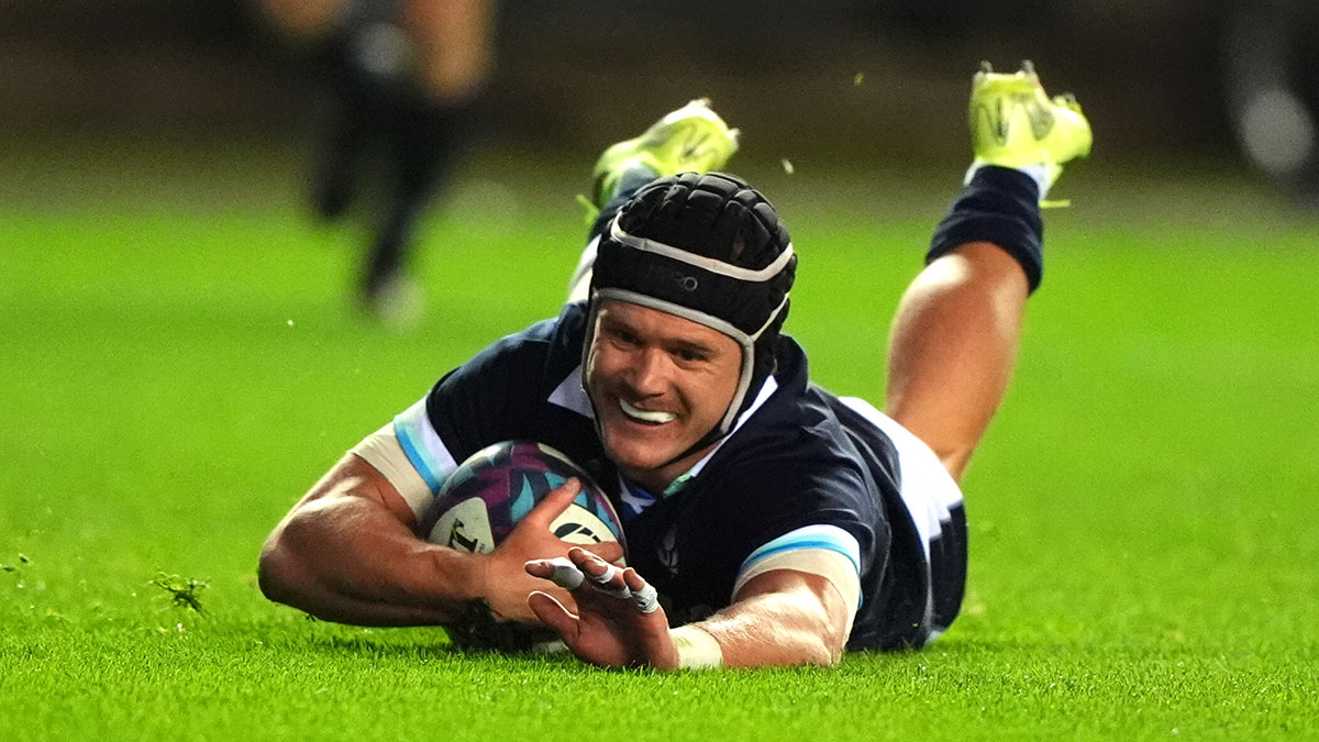 Darcy Graham slides in to score a try for Scotland v Fiji during 2024 Autumn Internationals