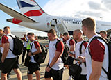 England players prepare to board the plane to Japan