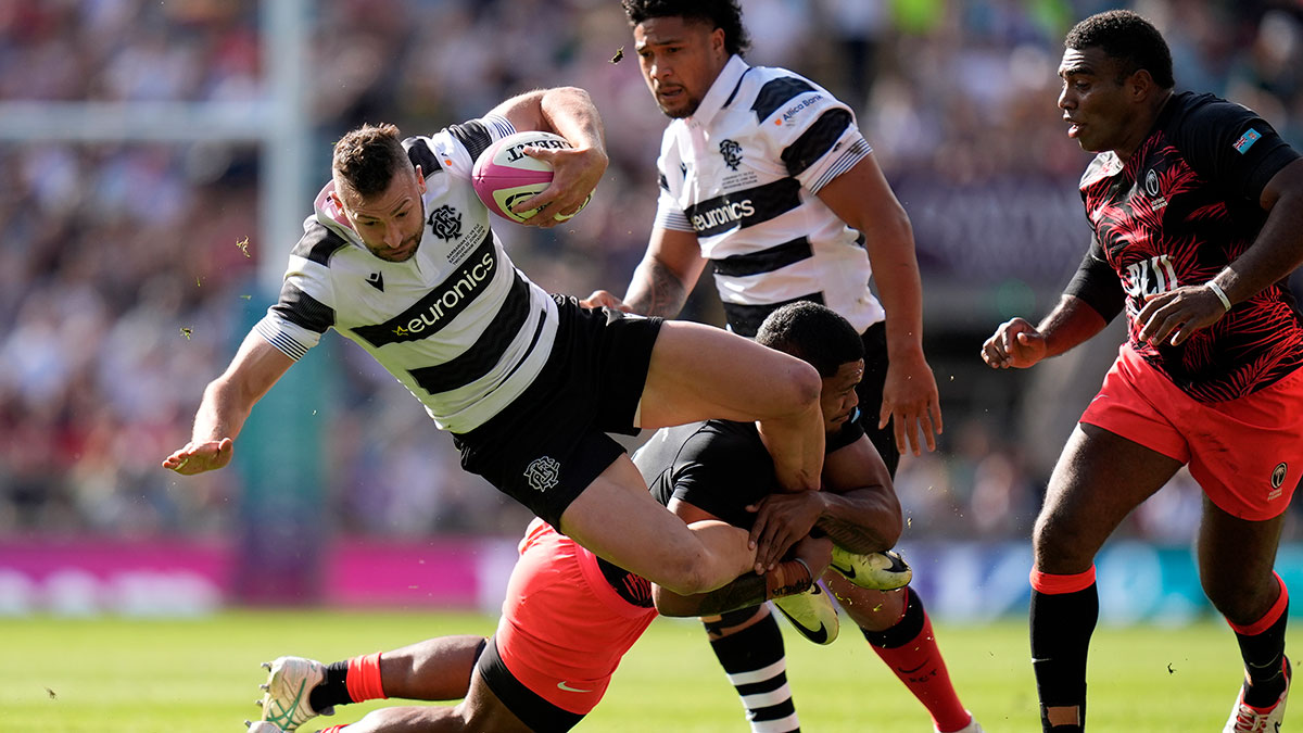 Jonny May is tackled during Barbarians v Fiji match in 2024 Summer Internationals