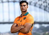 Joseph-Aukuso Suaalii poses in front of Sydney Harbour Bridge during Wallabies announcement