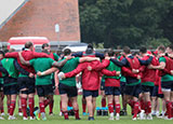 Lions players in a huddle during training session