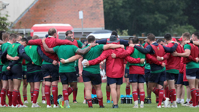 Lions players in a huddle during training session