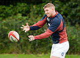 Ruaridh McConnochie passes the ball during an England training session