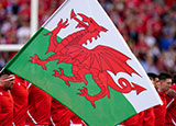 Welsh flag in front of Wales players before Italy v Wales match in 2023 Six Nations